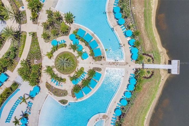 birds eye view of property with a water view