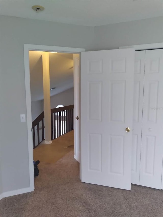 carpeted bedroom featuring a closet