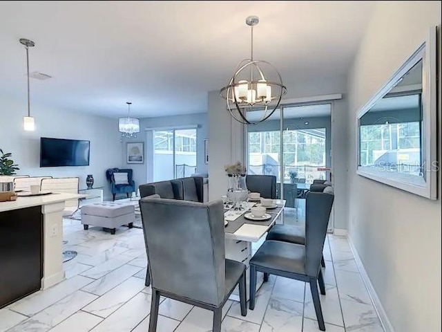 dining space featuring an inviting chandelier