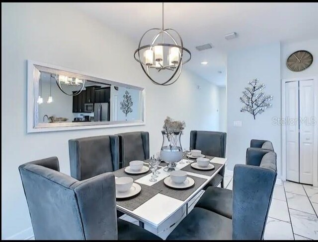 dining space with a notable chandelier