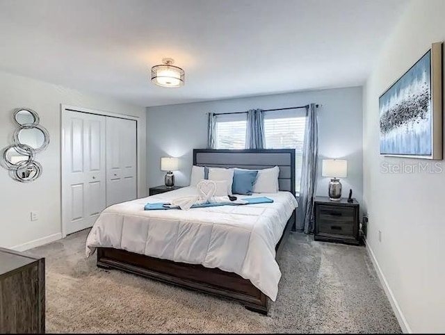 carpeted bedroom featuring a closet