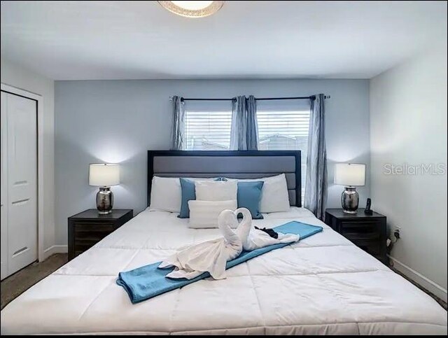 bedroom featuring dark hardwood / wood-style flooring