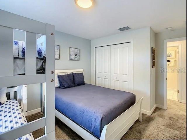 carpeted bedroom with a closet