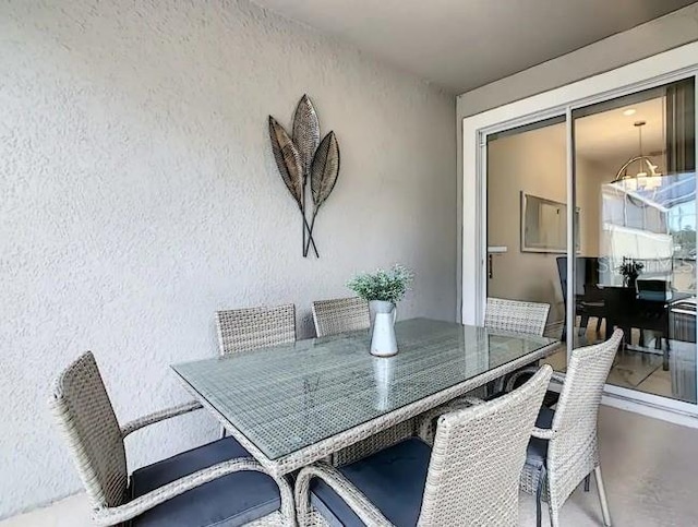 dining space featuring a chandelier