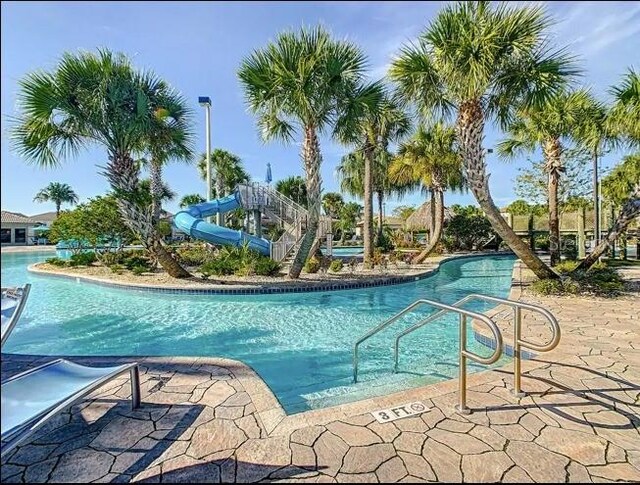 view of pool featuring a water slide