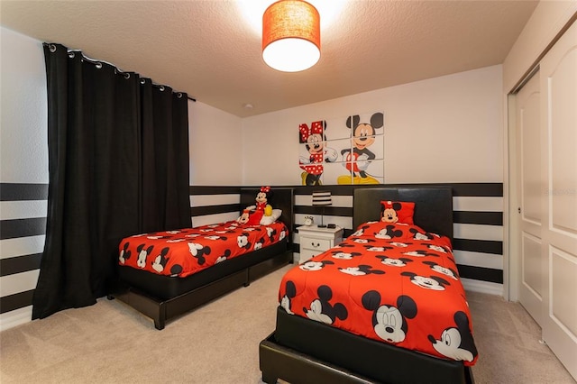 carpeted bedroom featuring a closet