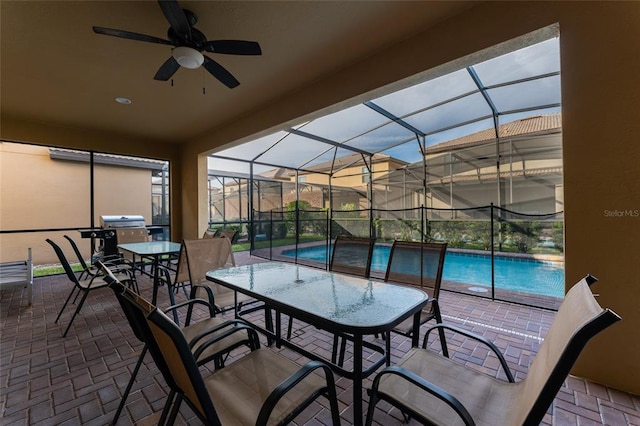 sunroom / solarium featuring a pool and ceiling fan