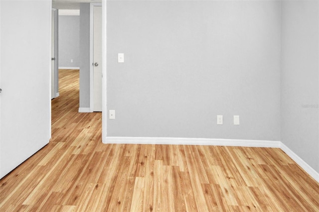 spare room featuring light hardwood / wood-style floors