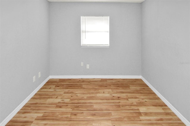 unfurnished room with light hardwood / wood-style flooring