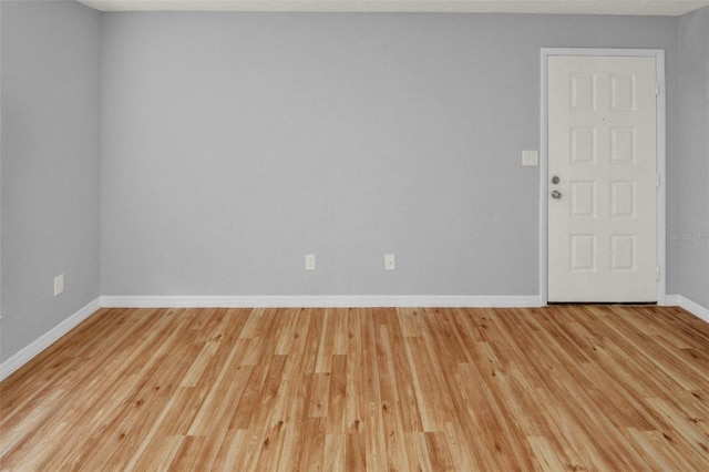 unfurnished room featuring light wood-type flooring