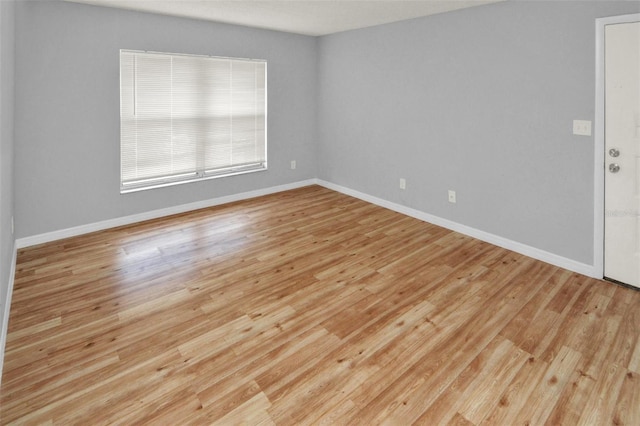 spare room featuring light wood-type flooring