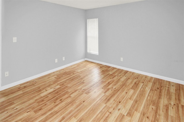 spare room featuring light hardwood / wood-style flooring