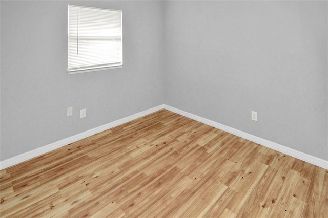 spare room with light hardwood / wood-style floors