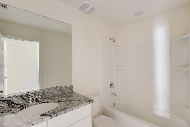 full bathroom featuring toilet, vanity, and bathing tub / shower combination