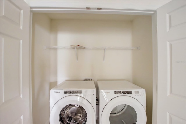 washroom with washer and dryer