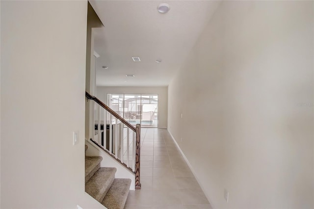 stairs with tile patterned flooring