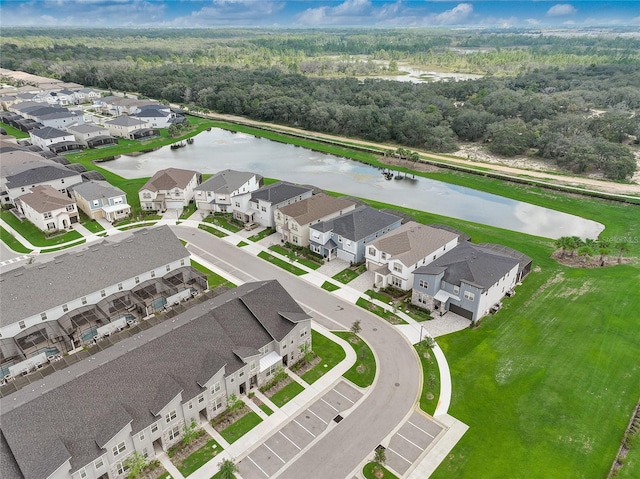 birds eye view of property featuring a water view