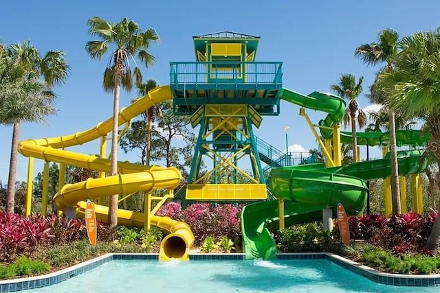 view of pool with a playground