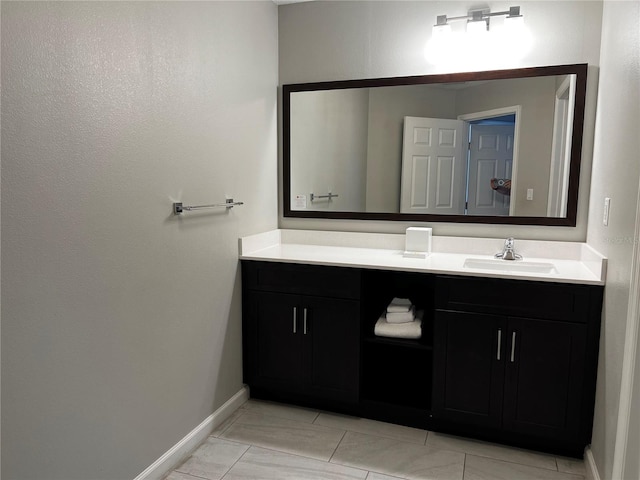 bathroom with vanity and tile floors