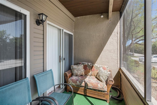 sunroom featuring wooden ceiling