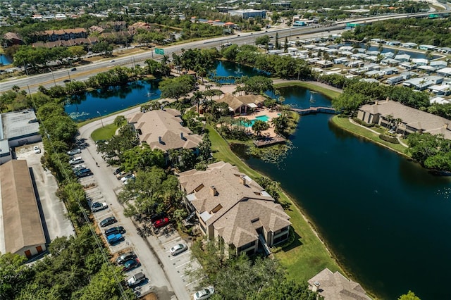 birds eye view of property featuring a water view