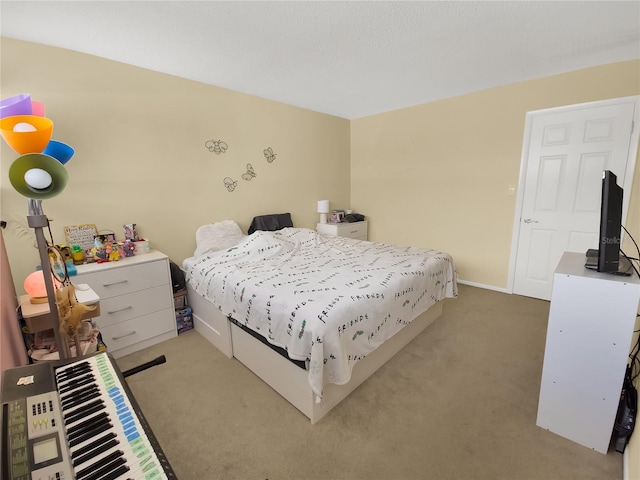 bedroom featuring light carpet