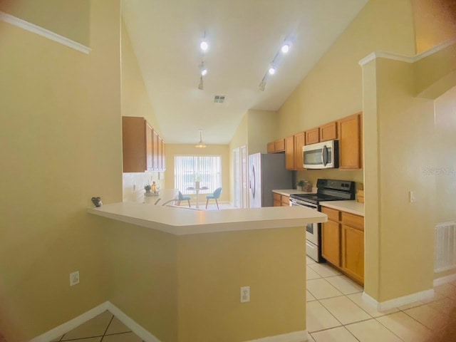 kitchen featuring kitchen peninsula, track lighting, high vaulted ceiling, stainless steel appliances, and light tile floors