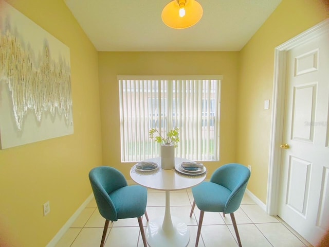 living area featuring light tile flooring