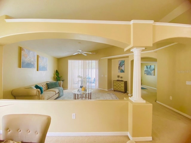 kitchen with light carpet, lofted ceiling, ceiling fan, and ornate columns