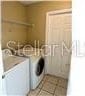 clothes washing area featuring washer and dryer