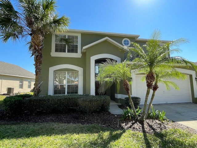 view of front of house featuring central AC and a garage