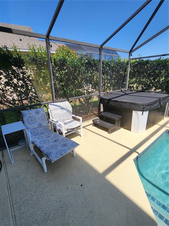 view of pool featuring a lanai and a patio