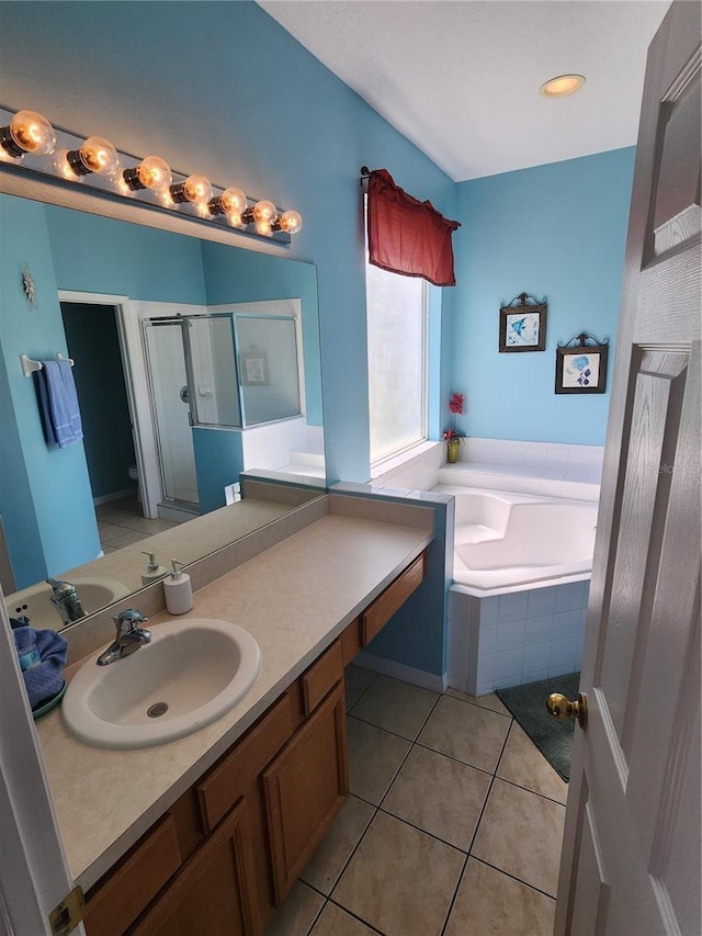 bathroom featuring separate shower and tub, tile patterned floors, and vanity