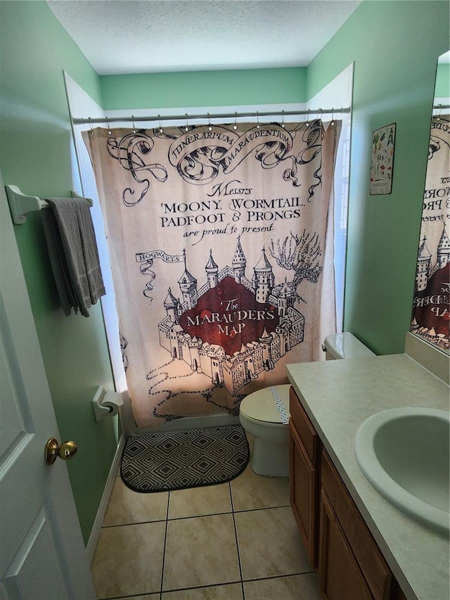 bathroom with curtained shower, tile patterned flooring, a textured ceiling, toilet, and vanity