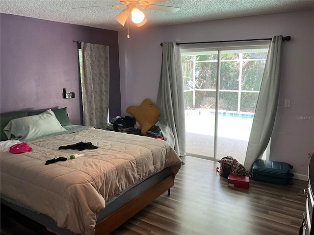 bedroom featuring a textured ceiling, ceiling fan, access to outside, and wood-type flooring