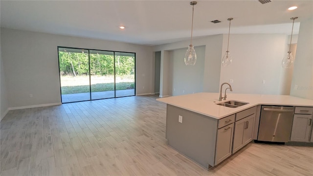 kitchen with light hardwood / wood-style floors, stainless steel dishwasher, pendant lighting, gray cabinetry, and sink