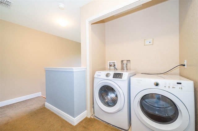 clothes washing area with light carpet, hookup for a washing machine, and independent washer and dryer