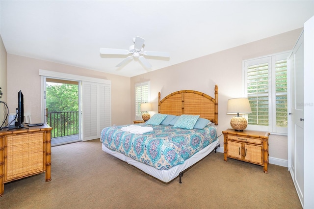 bedroom featuring access to outside, ceiling fan, and light colored carpet