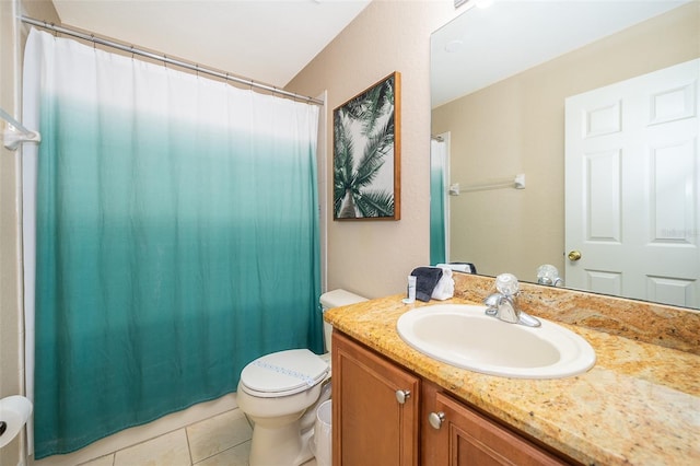 bathroom featuring toilet, tile floors, and vanity