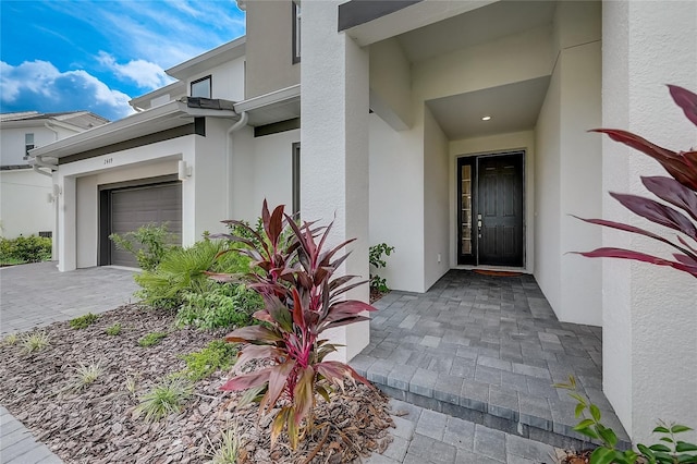 view of exterior entry featuring a garage