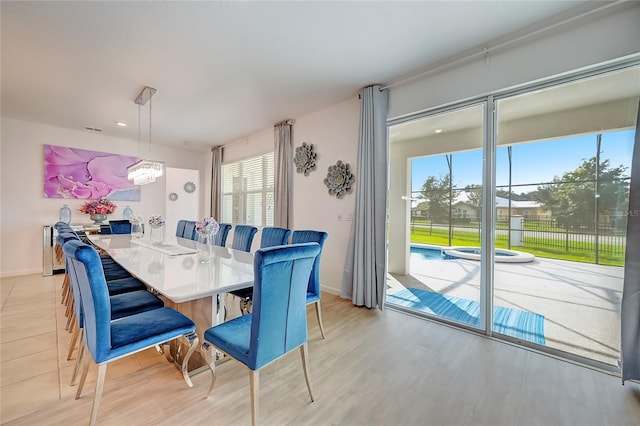 dining space with a notable chandelier