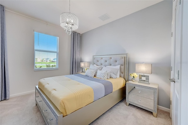 carpeted bedroom featuring a notable chandelier