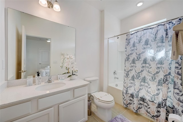 full bathroom featuring tile patterned flooring, shower / bath combo with shower curtain, vanity, and toilet