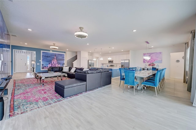 living room with light hardwood / wood-style flooring