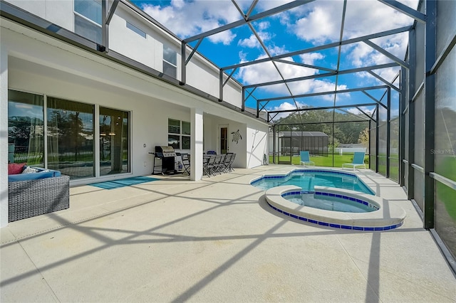 view of swimming pool with a patio, glass enclosure, an in ground hot tub, and grilling area