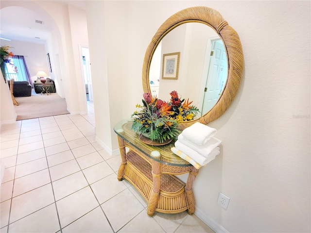 corridor featuring light tile flooring