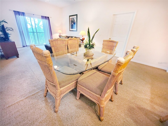 dining room with light colored carpet