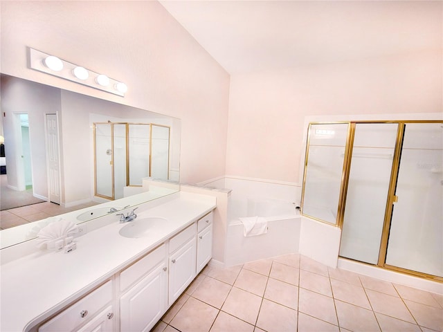 bathroom featuring tile floors, large vanity, and separate shower and tub