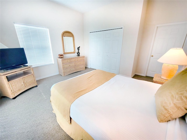 carpeted bedroom featuring a closet