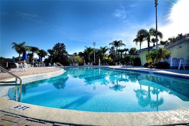 view of swimming pool featuring a patio area